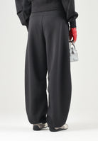 PUMA Pantalone PUMATECH nero da donna con linea balloon, vita elasticizzata e coulisse 636659 01 PUMA 