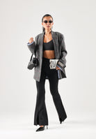 PUMA leggings ESSENTIALS PINTUCK neri da donna in cotone elasticizzato a coste, vestibilità slim fit con gamba leggermente svasata, vita alta, spacchi frontali sul fondo e piccolo logo PUMA Cat ricamato. 636674 01 PUMA 