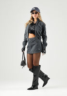 PUMA Gonna corta nera per donna con chiusura frontale con zip e logo ricamato. 636679 01 PUMA 