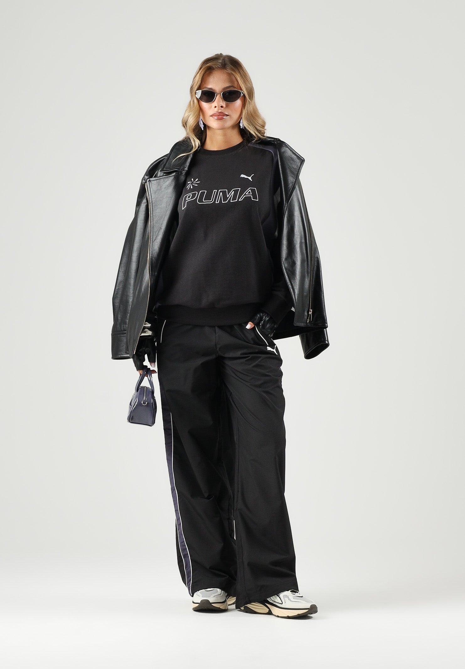 PUMA Felpa girocollo MOTO CREWNECK nera per uomo e donna con dettagli color block, logo frontale 636723 01 PUMA 