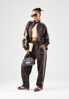 PUMA Pantaloni PLAID TRACK PANTS marrone per uomo e per donna con fantasia tartan, bande laterali tono su tono 636732 33 PUMA 