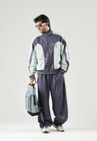 PUMA Felpa con zip OVERSIZED TRACK JACKET grigia per uomo bicolore con inserti a contrasto 636735 35 PUMA 