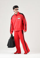 PUMA Pantaloni FERRARI RACE TRACK PANTS rosso da uomo con bande laterali nere e stemma della Scuderia Ferrari. 637056 02 PUMA 