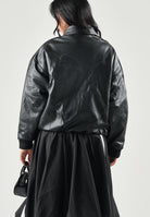 PUMA Giubbotto in pelle  FAUX LEATHER  nero da donna con colletto a camicia e zip frontale. 637143 01 PUMA 