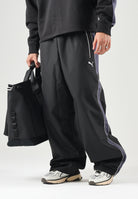 PUMA Pantalone nero da uomo con bande laterali e logo iconico 637378 01 PUMA 