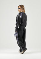 PUMA Pantaloni STRAIGHT neri da uomo con bande laterali e logo iconico 637378 01 PUMA 