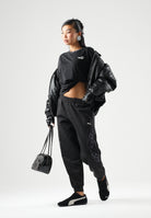 PUMA Pantalone DARE TO PRINTED  nero per donna con dettagli animalier sui fianchi e caviglie elasticizzate. 637612 01 PUMA 