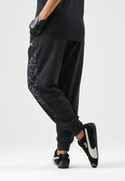 PUMA Pantaloni DARE TO PRINTED  neri per donna con dettagli animalier sui fianchi e caviglie elasticizzate. 637612 01 PUMA 
