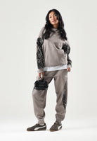 PUMA Pantalone DARE TO PRINTED beige per donna con dettagli animalier sui fianchi e caviglie elasticizzate. 637612 81 PUMA 