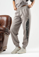 PUMA Pantalone DARE TO PRINTED beige per donna con dettagli animalier sui fianchi e caviglie elasticizzate. 637612 81 PUMA 