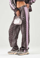 PUMA Pantalone PYTHON PRINT TRACK PANTS marrone e rosa da donna con stampa pitonata 638733 33 PUMA 