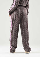PUMA Pantalone PYTHON PRINT TRACK PANTS marrone e rosa da donna con stampa pitonata 638733 33 PUMA 