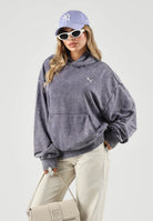 PUMA felpa con cappuccio DARE TO WASHED HOODIE viola slavato da uomo e donna in pesante tessuto felpato di puro cotone, con particolare lavaggio vintage,  spalle scese, cappuccio senza coulisse, tasca frontale a marsupio, polsini e fondo a costine e  638738 35 PUMA 