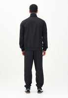 PUMA Tuta nera da uomo con piping intrecciato 684849 01 PUMA 