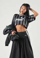 PUMA Polo a manica corta ESS Jersey nera da donna con logo iconico frontale 691702 01 PUMA 