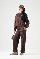 PUMA Tuta DOWNTOWN SWEATSUIT marrone per donna con mini logo iconico laterale 693995 33 PUMA 
