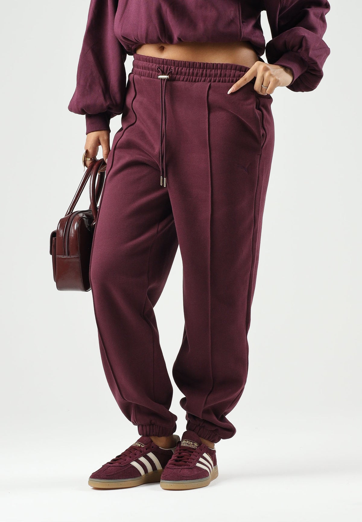 PUMA Pantaloni sportivi SWEATPANTS  bordeaux da donna con coulisse in vita e cucitura centrale 694032 24 PUMA 