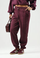 PUMA Pantaloni sportivi SWEATPANTS  bordeaux da donna con coulisse in vita e cucitura centrale 694032 24 PUMA 