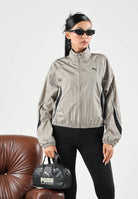 PUMA Giacca a vento DARE TO WOVEN TRACK  beige da donna con dettagli a contrasto e collo alto 694049 81 PUMA 