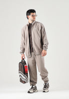PUMA Felpa con zip TRACK JACKET beige da uomo con profilo bicolore e colletto rialzato. 694298 81 PUMA 
