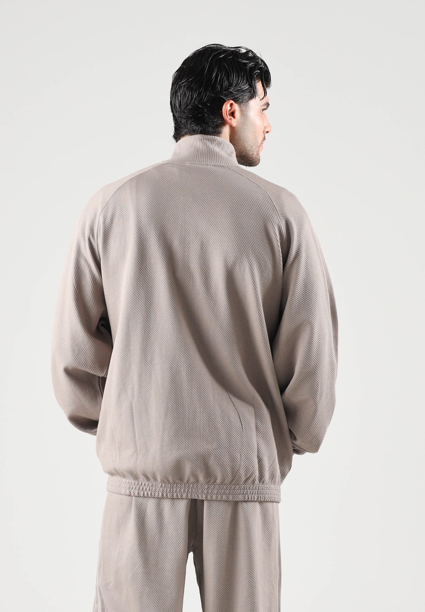 PUMA Felpa con zip TRACK JACKET beige da uomo con profilo bicolore e colletto rialzato. 694298 81 PUMA 