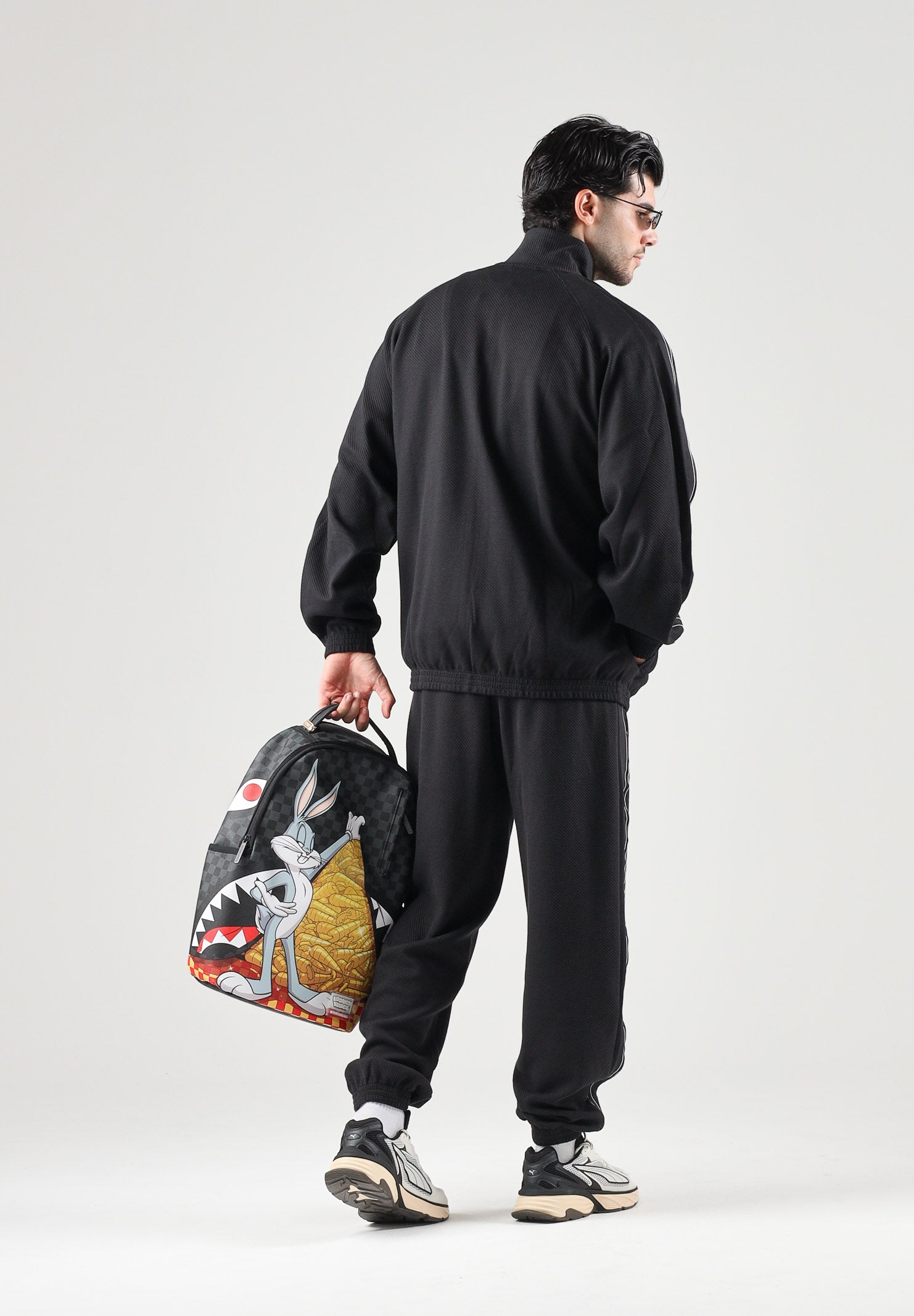 PUMA Pantaloni TRACK PANTS neri da uomo con profili laterali e fondo con polsino. 694300 01 PUMA 
