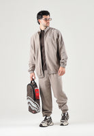 PUMA Pantalone T7 TRACK PANTS beige da uomo con profilo laterale e punto vita con coulisse. 694300 81 PUMA 