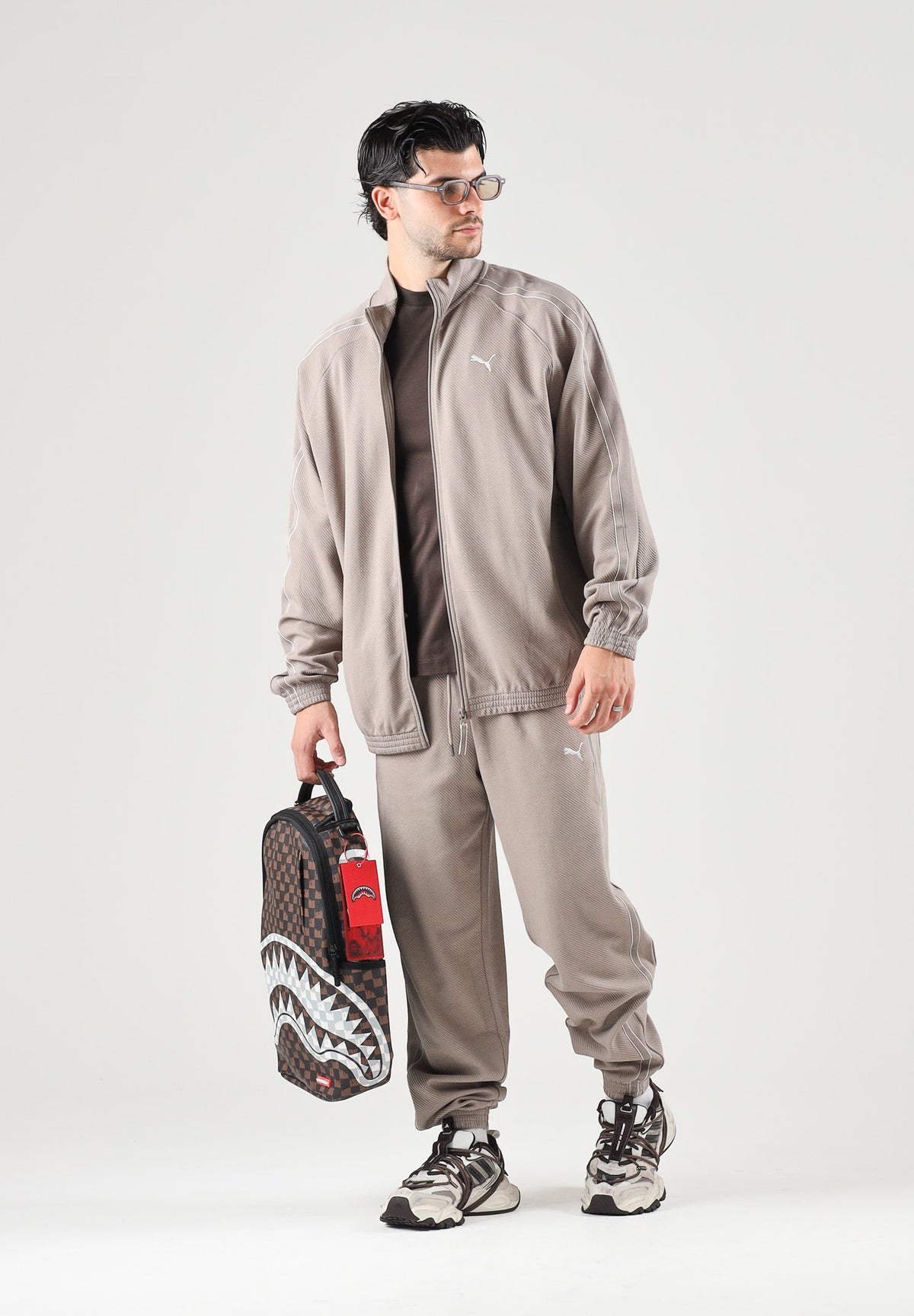 PUMA Pantalone T7 TRACK PANTS beige da uomo con profilo laterale e punto vita con coulisse. 694300 81 PUMA 