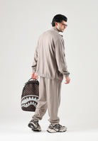 PUMA Pantalone T7 TRACK PANTS beige da uomo con profilo laterale e punto vita con coulisse. 694300 81 PUMA 