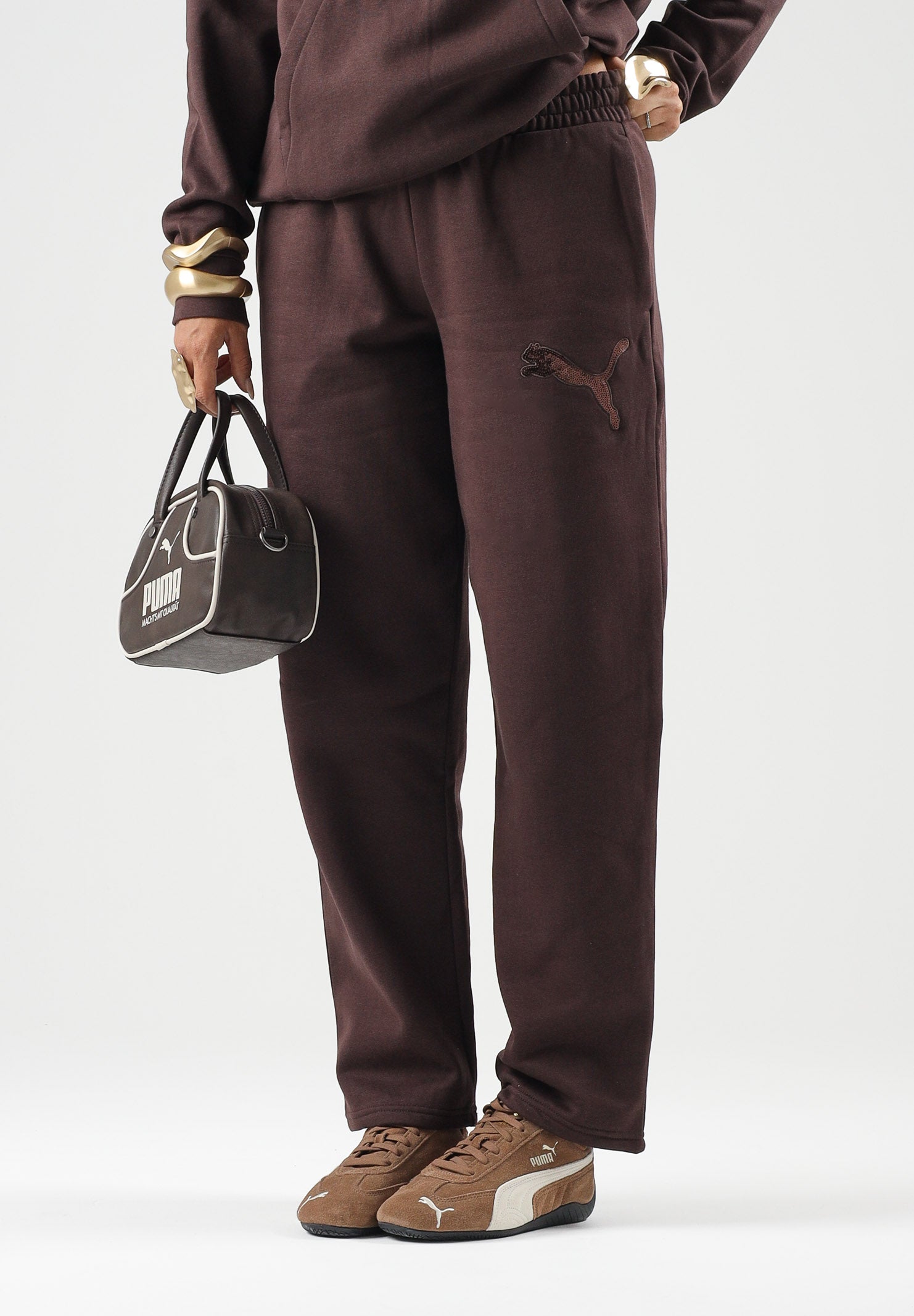 PUMA Pantaloni RHINESTON OPEN  marrone da doonna con logo in strass e fondo dritto. 694578 33 PUMA 