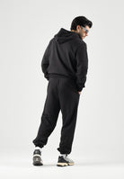 PUMA Tuta sportiva ESS HOODED SUIT nero da uomo con felpa zippata, cappuccio e pantaloni coordinati. 696906 01 PUMA 