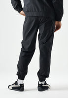 PUMA Pantaloni OLYMPIQUE DE MARSEILLE vibrant blue, blu e nero da uomo con dettagli logo e stemma 786450 20 PUMA 