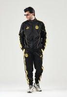 PUMA Pantaloni BORUSSIA DORTMUND TRACK PANTS nero da uomo con bande laterali gialle e caviglie elasticizzate. 786492 07 PUMA 