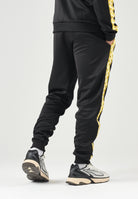 PUMA Pantaloni BORUSSIA DORTMUND TRACK PANTS nero da uomo con bande laterali gialle e caviglie elasticizzate. 786492 07 PUMA 
