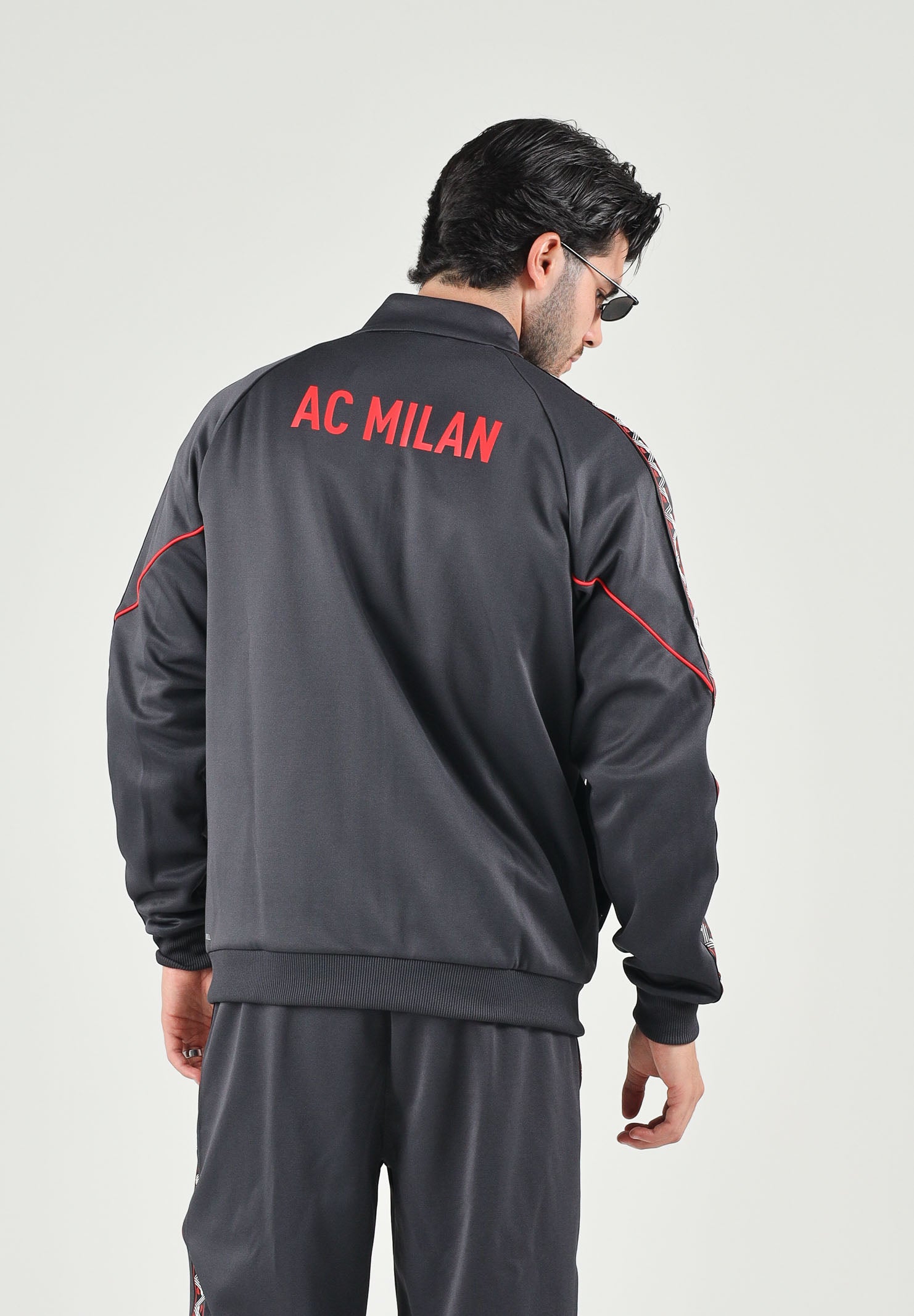 PUMA Felpa con zip  AC MILAN TRACK JACKET nero da uomo con colletto alto e profili rossi. 786735 17 PUMA 