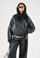 RAINS Giubbotto di pelle  HEAVY WOVEN JACKET nero per uomo e donna con cappuccio e maniche con pieghe strutturate RA19230 BL RAINS 