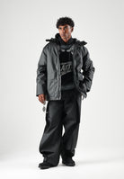 RAINS Parka nero per uomo e donna con cappuccio e visiera RA21450 BL RAINS 