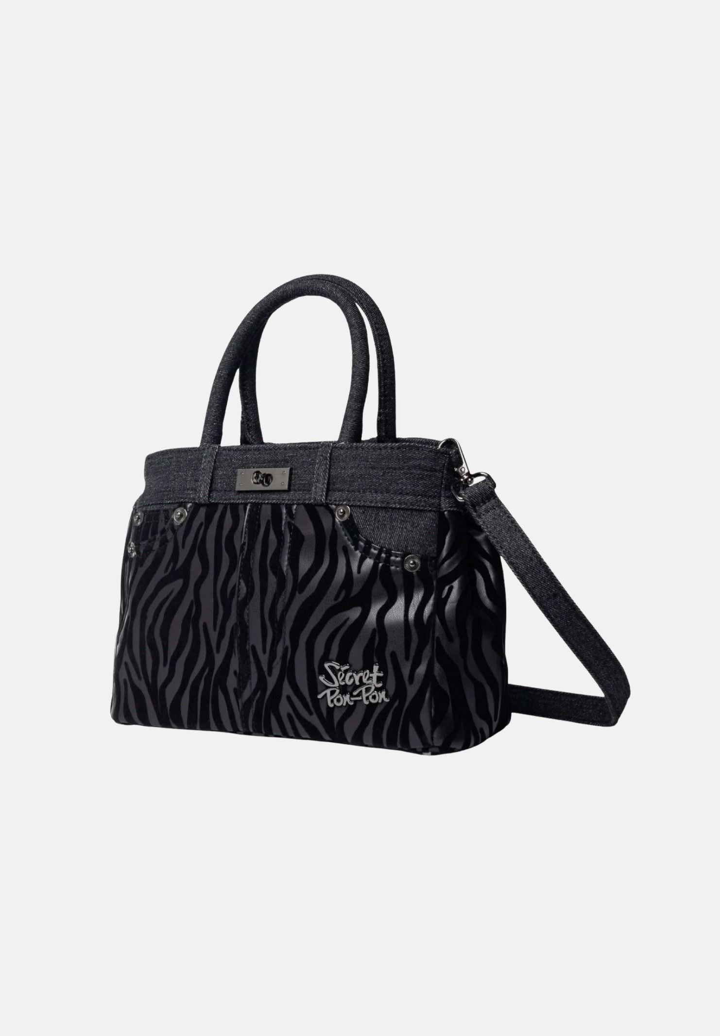 SECRET PON PON Borsa a mano KELSY ZEBRA Black nera da donna,  con fantasia zebrata, doppi manici e tracolla regolabile.<BR/> KELSY-ZEBRA ZE SECRET PON PON 