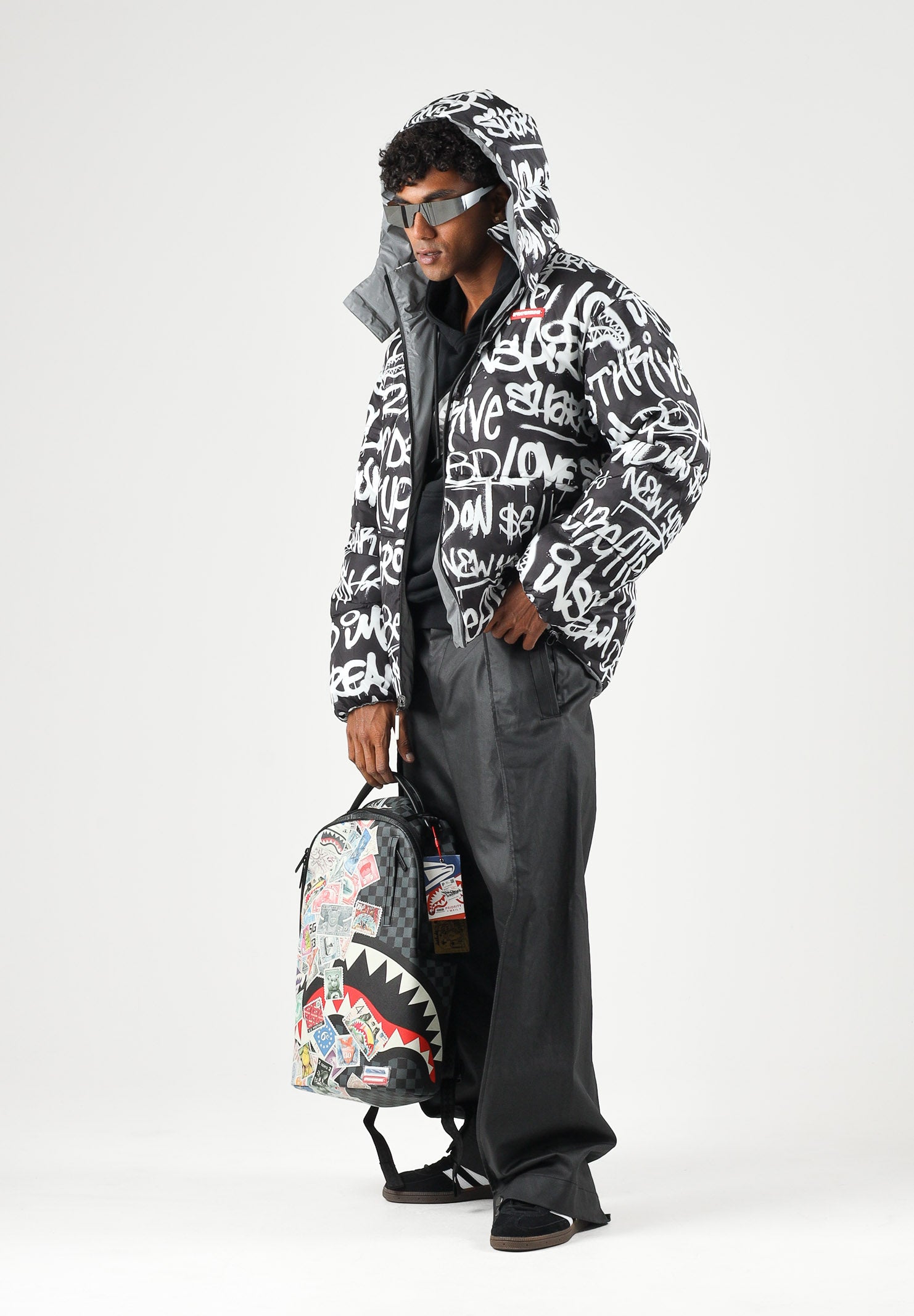 SPRAYGROUND Piumino grigio reversibile  per uomo e donna con cappuccio regolabile, chiusura frontale con zip SP942 . SPRAYGROUND 