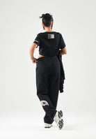 SPRAYGROUND Pantaloni neri per uomo e donna con comodo elastico in vita e dettagli grafici distintivi lungo la gamba. SP995GBLK . SPRAYGROUND 