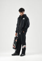 SPRAYGROUND Pantaloni neri per uomo e donna con comodo elastico in vita e dettagli grafici distintivi lungo la gamba. SP995GBLK . SPRAYGROUND 
