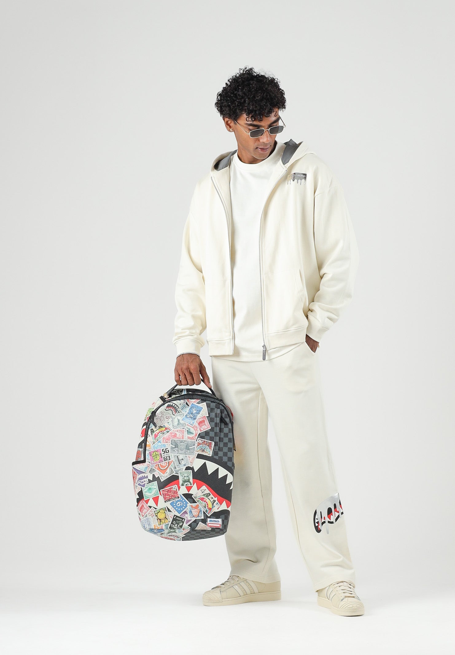 SPRAYGROUND Felpa con zip panna  per uomo e donna con cappuccio e tasche laterali. SP997GIVO . SPRAYGROUND 