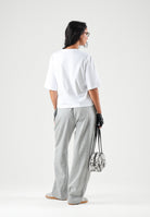 THE NORTH FACE Pantaloni SIMPLE DOME PANT grigio chiaro da donna con elastico in vita e polsini alle caviglie. NF0A8CWDCQO1 . THE NORTH FACE 