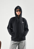 THE NORTH FACE Felpa con zip tnf black nera per uomo e donna  con pratica con cappuccio e tasche laterali. NF0A8EU1JK31 . THE NORTH FACE 