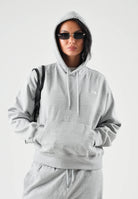THE NORTH FACE Felpa con cappuccio SIMPLE DOME HOODIE grigio da donna con tasca a marsupio frontale. NF0A8HBXCQO1 . THE NORTH FACE 