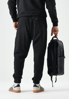 TOMMY JEANS Pantaloni da tuta TJM REGULAR nero da uomo con logo firma a contrasto.<BR/> DM0DM23903 BDS TOMMY JEANS 