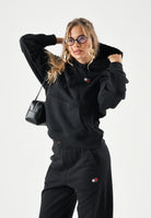 TOMMY JEANS Felpa con cappuccio nera da donna rifinita da logo DW0DW19414 BDS TOMMY JEANS 