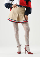 TOMMY JEANS minigonna pieghettata Global Stripe Tape Pleated Mini Skirt  Gentle Gold beige da donna. DW0DW22969 AB9 TOMMY JEANS 
