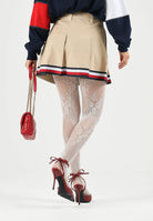 TOMMY JEANS minigonna pieghettata Global Stripe Tape Pleated Mini Skirt  Gentle Gold beige da donna. DW0DW22969 AB9 TOMMY JEANS 