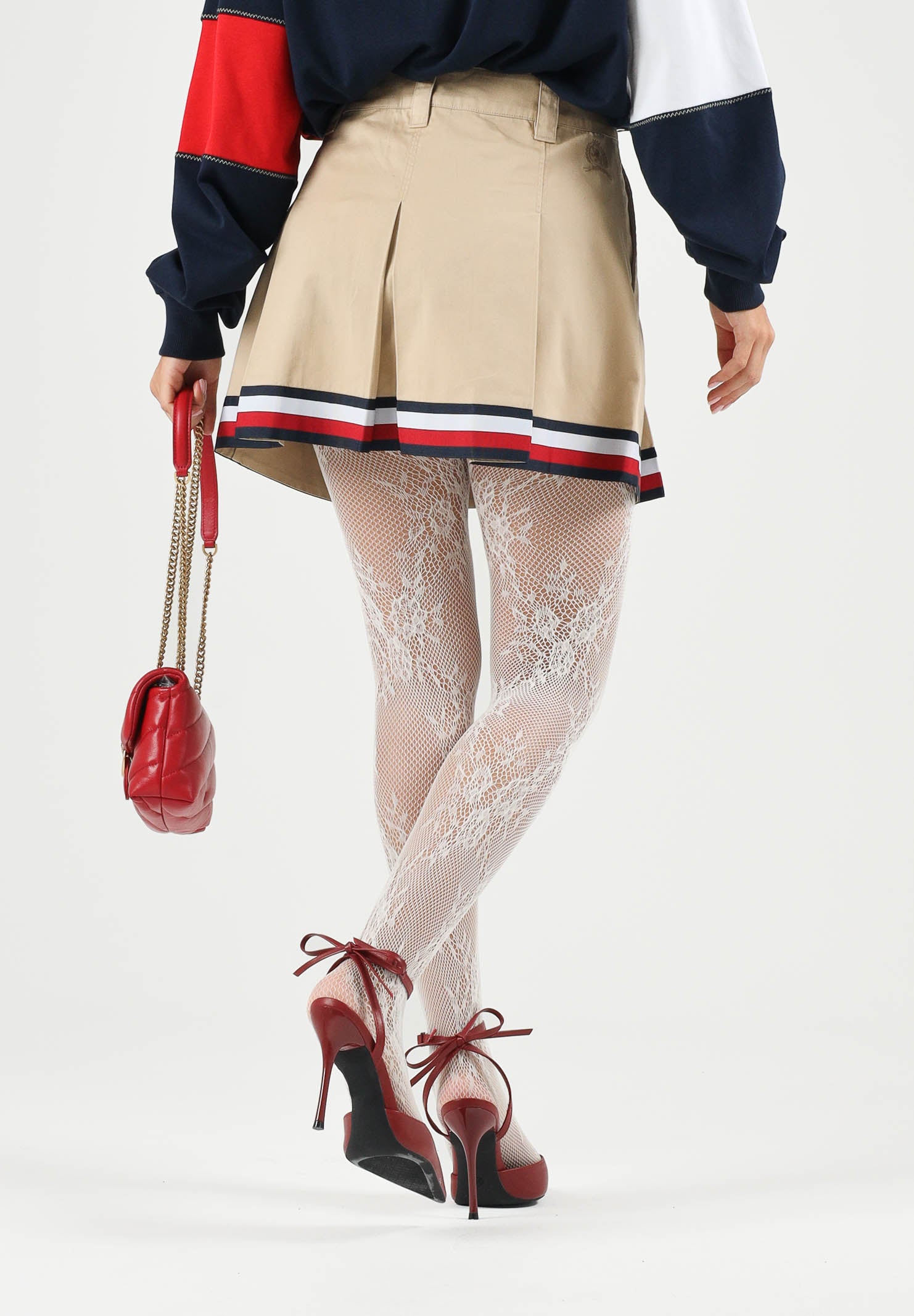 TOMMY JEANS minigonna pieghettata Global Stripe Tape Pleated Mini Skirt  Gentle Gold beige da donna. DW0DW22969 AB9 TOMMY JEANS 